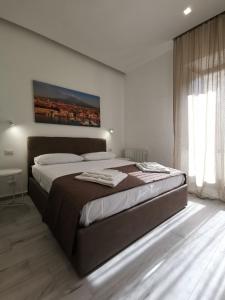 En eller flere senge i et værelse på Trinity Apartment