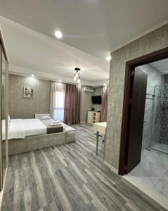Postel nebo postele na pokoji v ubytování Luxmani Hotel & Spa