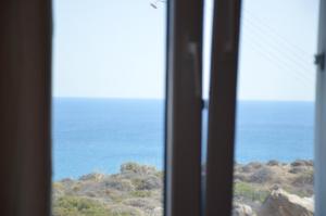 a view of the ocean from a window at Summer Residence in Provatas