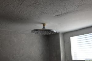 a ceiling with a light in a room with a window at Summer Residence in Provatas