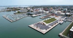 an aerial view of a marina with boats in the water at The Aviator's Club - Central Downtown Sandusky in Sandusky