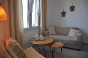 a living room with a couch and a table at Summer Residence in Provatas