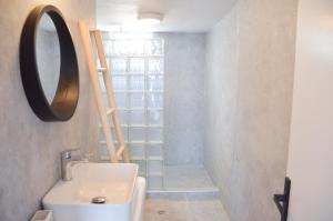 a bathroom with a sink and a mirror at Summer Residence in Provatas