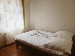 Łóżko lub łóżka w pokoju w obiekcie Pokoje gościnne Jola
