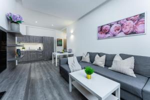 a living room with a couch and a table at Wenceslas square apartment in Prague