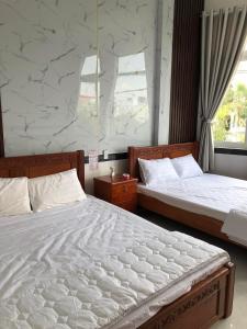 Katil atau katil-katil dalam bilik di Khách sạn Ánh Sáng