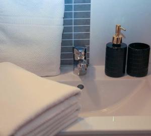 a bathroom counter with a sink and a towel at Adrian-Apartments-51511-Malinska-Otok-Krk Primorska 21 in Malinska +25 photos