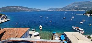 a view of a harbor with boats in the water at Villa del mare in Herceg-Novi