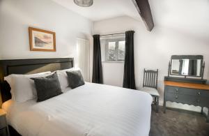 Un ou plusieurs lits dans un hébergement de l'établissement Sawmill Cottage, Coniston Water