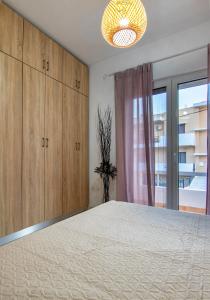 Postel nebo postele na pokoji v ubytování Anali Apartment
