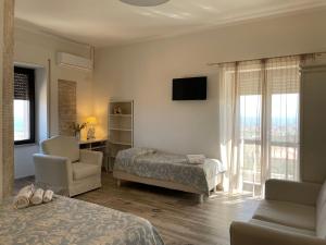 A bed or beds in a room at Don Giacchì Country House