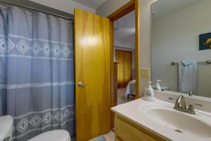 a bathroom with a sink and a toilet and a shower at Mtn-View Escape with Hot Tub, 9 Mi to Skiing! in Maggie Valley +18 photos