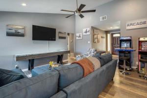 a living room with a couch and a piano at San Antonio Home with Private Hot Tub Pets Welcome! in San Antonio