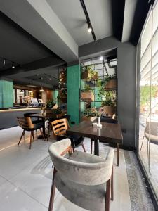 a dining room with a table and chairs at Vila 90 Boutique Hotel in Tirana
