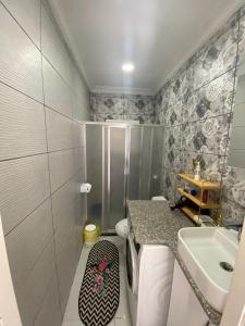 a bathroom with a toilet and a sink at DENİZE 5 DAKİKA VE DOĞA EVİ in Cesme