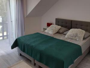 Pokoje i apartamenty MatDar客房内的一张或多张床位