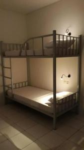Ένα ή περισσότερα κρεβάτια σε δωμάτιο στο Bujang Lapuk Hostel
