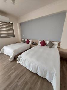 Postel nebo postele na pokoji v ubytování Miss Travel Homestay