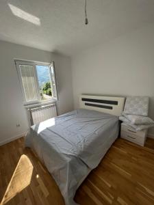 מיטה או מיטות בחדר ב-Duča Apartmani