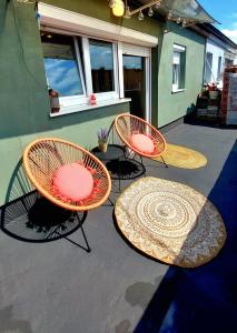 a group of tables and chairs on a patio at Apartment Amarone, 4th floor, no elevator in Zagreb +14 photos