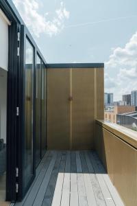 a balcony of a building with a view of the city at Access Brick Lane in London