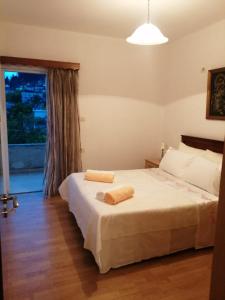 Postel nebo postele na pokoji v ubytování Maria Apartment
