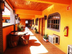 an outdoor patio with a table and a heater at Hotel La Hacienda de la Langosta Roja in San Felipe