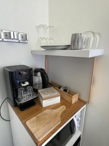 Kuchyň nebo kuchyňský kout v ubytování Le bourget - Suite romantique