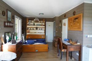 a bedroom with a bed and a desk and a table at Studio indépendant in Saint-Maurice