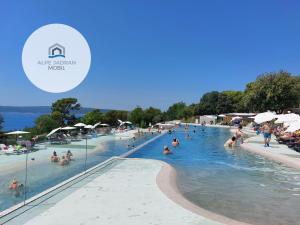 a group of people in the swimming pool at a resort at MOBILE HOMES SELCE - ALPE JADRAN MOBIL 641 in Selce