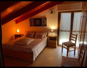 Postel nebo postele na pokoji v ubytování B&B Su Canistreddu