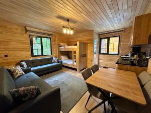 a living room with a couch and a table at Paye Suite in Uzungöl