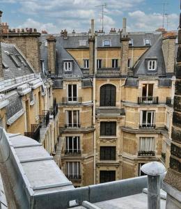 a view of a building from a balcony at Sur les Toits de Paris in Paris