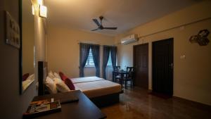 Oryx Home The Business Class Hotel客房内的一张或多张床位