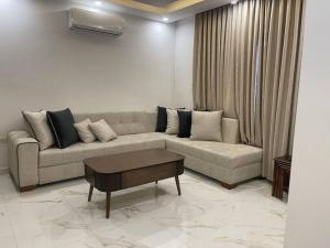 Posezení v ubytování Oqdeh Delux Apartments
