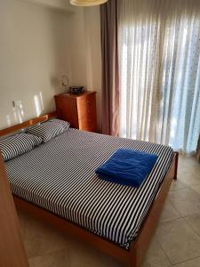 Postel nebo postele na pokoji v ubytování ΛΕΛΑ
