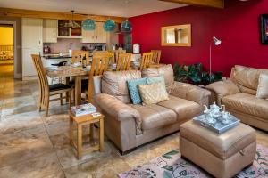 a living room with a couch and a table at Finest Retreats - Skyview Lodge in Eglwys-Fâch