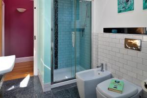 a bathroom with a toilet and a glass shower at Finest Retreats - Skyview Lodge in Eglwys-Fâch +31 photos