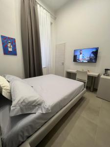 Cama o camas de una habitación en Dimora Chiaia 209