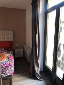 Кровать или кровати в номере La clau de la vall +6 фотографий