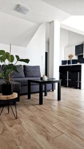 a living room with a couch and a table at Belvedere Premium in Novalja