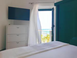 Voodi või voodid majutusasutuse Terrazza Diomede Manfredi Homes&Villas toas