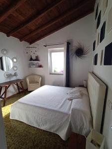 A bed or beds in a room at Baja Sardinia