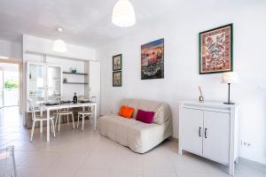 a living room with a couch and a table at [Fronte Mare]-Sweet Home-[Free Parking] in Marina di Pisa