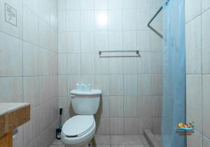 a white bathroom with a toilet and a shower at Magnificent Beach side home with WiFi Jerry`s condo #1 in San Felipe +14 photos