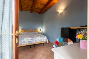 A bed or beds in a room at Agriturismo Cantine Bevione - Rooms with air conditioning