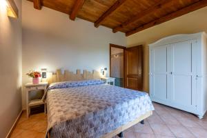 A bed or beds in a room at Agriturismo Cantine Bevione - Rooms with air conditioning