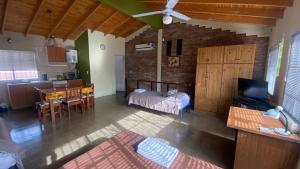 a living room with a bed and a dining room at Monoambiente Luminoso y Tranquilo in Mendoza