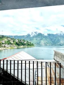 a view of a body of water with mountains at Nicolas House #2 with Lake Atitlán View in San Pedro La Laguna