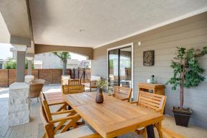 a wooden table and chairs on a patio at Luxe San Antonio Vacation Rental with Private Pool! in San Antonio